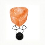 Heart shape Himalayan salt candle holder with metal stand glowing warm amber light