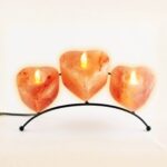 Pack of 3 heart shape Himalayan salt candle holders with metal stand glowing warm amber light