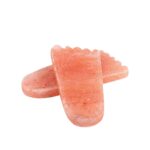 Feet-shaped Himalayan salt detox plate used for foot therapy in spa and home wellness settings