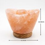 Ingot shape Himalayan pink salt lamp with wooden base emitting warm amber glow night light for home decor