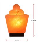 Trapezoid fire bowl Himalayan salt lamp with natural salt balls glowing warm amber light on wooden base