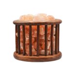 Wooden cage Himalayan salt lamp in modern interior setting